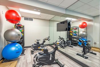 Well-equipped athletic club offering cardio machines and strength training equipment
